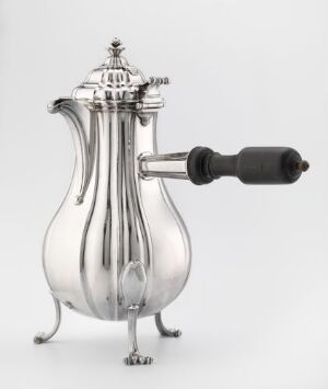  Antique "Kaffekanne" coffee pot by Antoine Joseph Gellez, made of silver with a curved body and a turned wooden handle, standing on four delicate feet with a decorative lid finial, showcased against a light gray background.