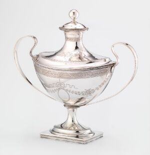  An antique silver sugar bowl with decorative patterns and two handles, resting on a square base, against a light gray background. Artist name and title are unknown.