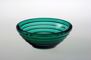  A teal-colored press glass bowl with concentric circular design by artist Sverre Pettersen.