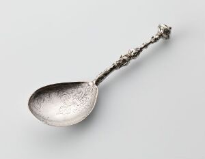  An antique silver spoon known as "Skje" with engraved floral designs in the bowl and ornate detail on the handle, created by an unidentified artist.