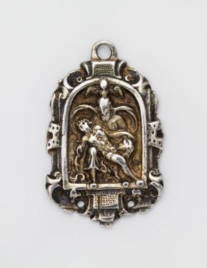  An ornate antique silver pendant with baroque detailing and a central figure relief, displayed against a neutral background. The artist's name and title are unknown.