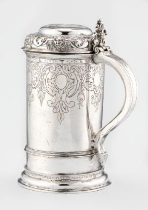  Antique silver drinking jug "Drikkekanne" by Gullik Amundsen featuring intricate engravings and a curved handle, reflecting light with a polished finish.