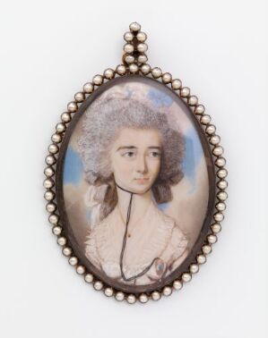  An 18th-century style oval miniature portrait of an individual with a white curly wig and a lace cravat against a soft blue background, encircled by a decorative pearly bead frame.