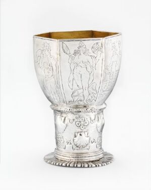  A silver goblet, titled "Drikkebeger" by artist Hinrich Meyer, with a textured exterior featuring engravings and a partially gilded upper surface, resting on a detailed round base. The goblet has an aura of elegance and historical value.