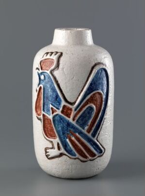  A stout ceramic vase with a short neck and an off-white base color features a stylized blue and brown bird design wrapped around it, set against a neutral gray background.