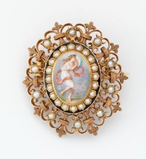  An antique brooch with a gold-toned filigree frame and pearls surrounding a pastel-toned cherub cameo set on a white background.