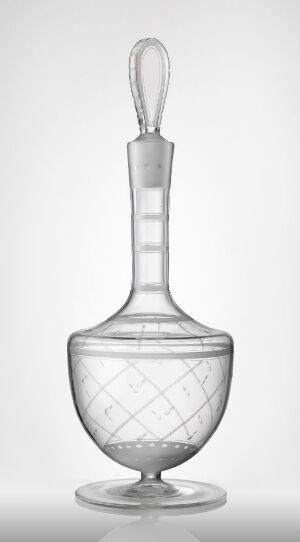  "Bankett," a clear blown glass decanter with etched and engraved decoration by Hadeland Glassverk, featuring a bulbous body, slender neck, and loop handle, standing on a flat base.