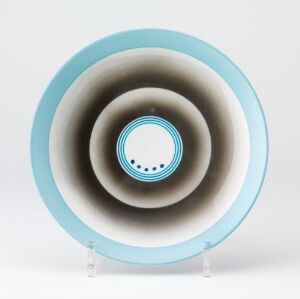  A circular object resembling a plate with a concentric ring design, featuring a cyan-blue outer rim and a central circle, with an illusion of depth created by gradations of grey in between.