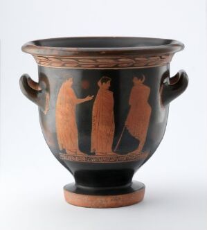  An ancient Greek red-figure bell krater with two arched handles and a black-glazed background featuring three profiled figures dressed in traditional garments.