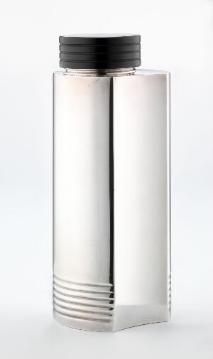  A sleek, stainless steel rectangular flask with a matte black screw-on cap and horizontal grooves at the bottom, set against a light background with a subtle shadow to the right.