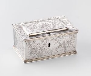  The "Skrin" by an unidentified artist is a small, engraved silver chest with copper pins and an iron lock, showcasing detailed decorative patterns typical of historical metalwork.