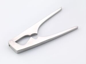  A stainless steel household utensil with a mirror-like finish by J. & J. Wiggin Ltd, featuring long, sleek arms connected at a pivot point with a U-shaped cutout at the end against a neutral background.