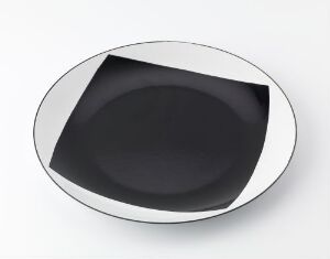  A Cathrineholm-designed bowl made of enameled iron, featuring a stark white glossy rim and a matte black interior set against a plain white background.