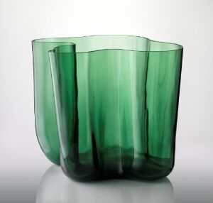  "Savoy" decorative vase by Karhula oy, featuring form-blown green-tinted glass with a wavy outline and varying shades of green.