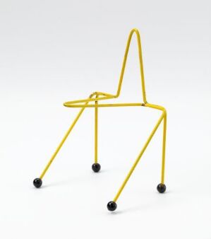  "EkstreMicro," a modern art chair design by Terje Ekstrøm, featuring slender, loddet and lacquered yellow metal tubes with black feet, standing against a white background.