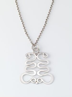  Sterling silver pendant with an abstract curvilinear design by artist Anna-Greta Eker, hung on a matching chain against a light background.