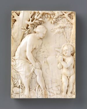  An intricately carved ivory relief depicting a classical scene with a partially draped woman tending to the earth and a cherub-like child beside her, set against a detailed backdrop of trees and foliage. Artist name and title unknown.
