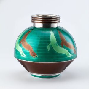  A spherical glass bottle with a metallic top, featuring a turquoise to brown gradient and two stylized fish, one orange and one green, painted or embedded onto its surface. Artist name and title unknown.