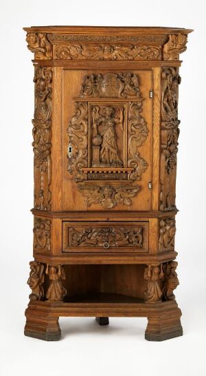  An antique wooden cabinet with detailed carvings, featuring an ornate cornice, central door with a lyre motif, and columns with vine designs, set against a neutral backdrop. Artist name and title are unknown.