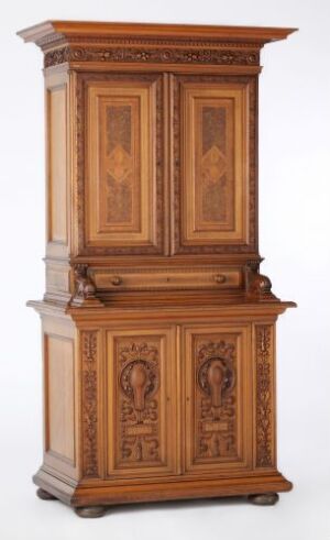  A traditional two-tier wooden cabinet with intricate wood grain patterns and classical design features standing against a light-colored background.