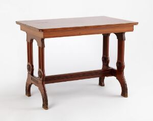  A mahogany table with carved ornaments titled "Bord" by A. Huseby & Co, showcasing classic design elements against a neutral background, emphasizing the warm reddish hue and craftsmanship.