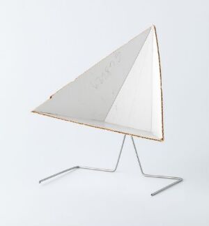  A modern white equilateral triangular panel with a gray border leaning on a sleek metallic tripod stand against a plain white background, embodying a minimalist design aesthetic.