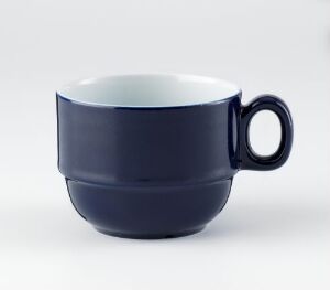  A navy blue porcelain cup with a glossy finish from the Korulenserviset by Porsgrunds Porselænsfabrik AS, featuring a stark white interior, displayed against a neutral background.