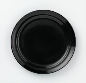  A sleek, deep black porcelain plate with a glossy finish, designed by Tias Eckhoff, showcasing an elegant and minimalist Scandinavian design devoid of any patterns or embellishments.