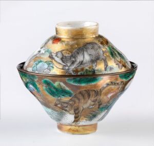  An ornate glass vase with a narrow gold-trimmed neck and a rounded body, depicting a painted rhinoceros and tiger among colorful environmental details.