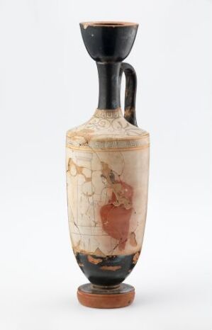  An ancient ceramic vessel, likely Greek or Roman, with a flared base and mouth both painted black, a creamy off-white body with faded figural decorations, and a single black handle. The vessel shows signs of age, with patches of reddish-brown on its surface.