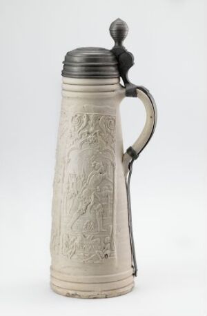  A stoneware stein titled "Samson og Dalila" by Hans Hilgers, featuring thrown and modeled stoneware with salt glaze, pressed and applied relief decorative work, and a cast pewter lid. The stein is earthy white-grey with a subtle sheen and detailed relief artwork, contrasting with the metallic gray lid.