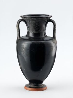  An antique black ceramic amphora vase with two vertical handles and a shiny finish is displayed against a light gray background. The vase embodies a classic symmetrical form, tapering to a flat-ended point at the base which is resting on a small terracotta-colored stand.