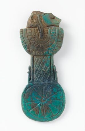  An ancient Egyptian faience amulet of the goddess Sekhmet, with a lioness head in shades of turquoise and green, featuring incised lines and a glossy finish, crafted by an unidentified Egyptian artist. The amulet includes a detailed headdress on the goddess's head, a columnar body with geometric patterns, and a circular base with an eight-pointed star design.