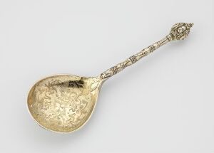  An ornate silver spoon, identified as "Sølvskje" by an unidentified artist, with a polished, reflective surface displaying engravings and gilded details, against a neutral background.