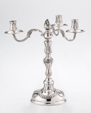  A shining three-armed silver candelabra with intricate detailing, set against a light, gradient background, displaying elegance and antique charm.