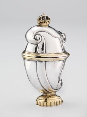  An ornate urn with a silver body and a gold base and crown, suggestive of regal inspiration, with a background of neutral tone to emphasize its elegance and craftsmanship.