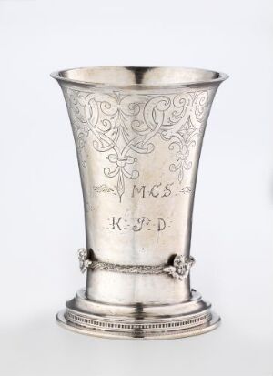  A silver drinking vessel titled "Drikkebeger" by Christopher Jørgensen, with a flared lip, robust and decorated base, the body embellished with intricate engravings, and featuring initials inscribed on its side.