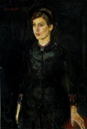  "Inger Munch in Black" is an oil painting by Edvard Munch, portraying a woman dressed in black standing against a dark background. The woman's pale face and solemn expression are illuminated amidst the subdued color palette, highlighting her introspective presence.