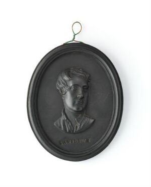  Portrait medallion of Viscount George Granville Lansdowne by Wedgwood, featuring an oval-shaped, bas-relief profile image of the viscount in dark grey stoneware, with a simple loop for hanging at the top edge.