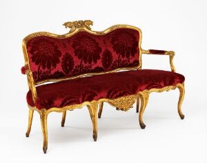  "Sofa" by Johan J. Katzenberg, featuring a gilded birch wood frame with intricately carved details and rich red velvet upholstery.