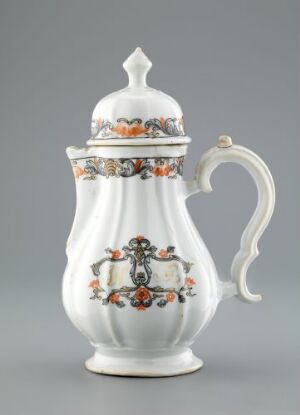  An elegantly shaped white ceramic coffee or tea pot with decorative bands featuring rust-colored flowers and whimsical medallions, set against a grey background.