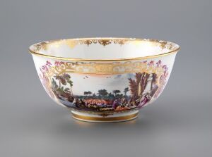  An ornate bowl with a flared rim and decorated with a gold band and a painted pastoral scene, against a light grey background.