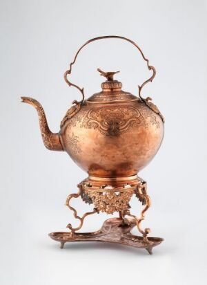  A copper water kettle (Vannkjele) with embossed designs, featuring a globular body, an ornate spout, and lid, a high-arching handle, resting on a decorative copper stand. The artist is unidentified.