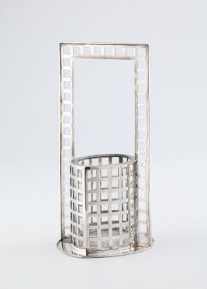  A silver metal sculpture of a hollow rectangular frame with a bent, grid-patterned structure within, set against a plain light background.