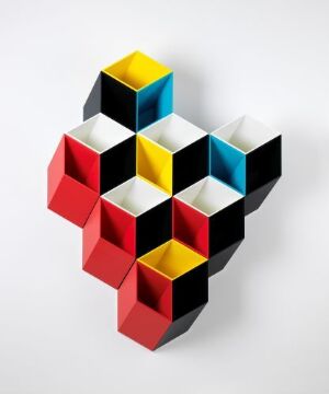  The "Imeüble Geometric storage system" by Bjørn Jørund Blikstad, featuring a complex array of interlocking black MDF cubes with interior faces painted in primary colors (yellow, red, blue), creating a striking three-dimensional effect.