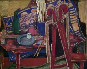  "Still Life in the Studio" by Alf-Jørgen Aas, an oil painting on canvas featuring a lively studio scene with a red and brown table holding a blue plate, a white cup, an apple, and a vase. A red chair with a book, a patterned tapestry in blue, white, and maroon, and a large string instrument in red-brown contribute to the rich, colorful composition, evoking the vibrancy of an artist's creative space.