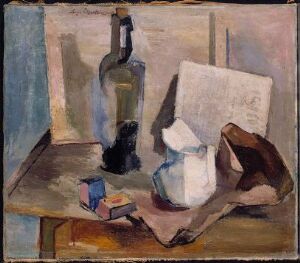  "Stilleben med flaske og mugge" by Aage Storstein is a still life oil painting on canvas featuring a green bottle, a beige jug, a white rectangular object, a blue rectangle that could be a book or a box, and a draped brown cloth, all arranged on a wooden table against a backdrop of cool gray and blue walls.