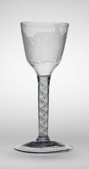  A gravert glass wine glass from the Flateby series by Nøstetangen Glassverk, with an intricate diamond pattern on the stem and base, set against a light-grey background, showcasing its transparent and ornate design elements.