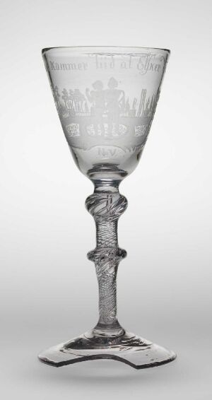  An elegantly crafted clear glass goblet by Nøstetangen glassverk titled "Desert med Perler og Slanger," featuring a wide engraved bowl atop a twisted stem with a square base, exemplifying historical blown glass design and artistic engraving techniques.