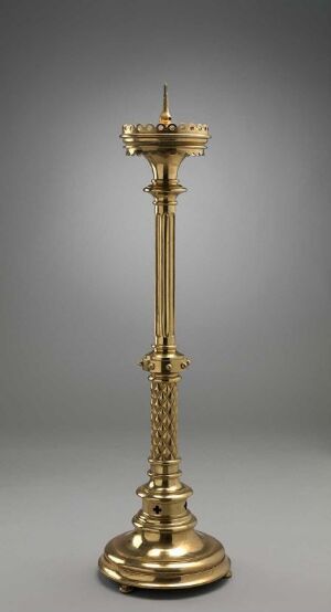  A slender golden candlestick holder with classical decorative elements, standing on a circular base with a twisted shaft and ornate details, displayed against a neutral gray background. Artistname and title are unknown.